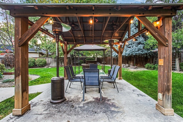 view of patio / terrace featuring a gazebo and ceiling fan