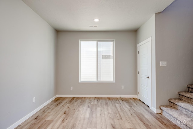 unfurnished room featuring light wood-type flooring