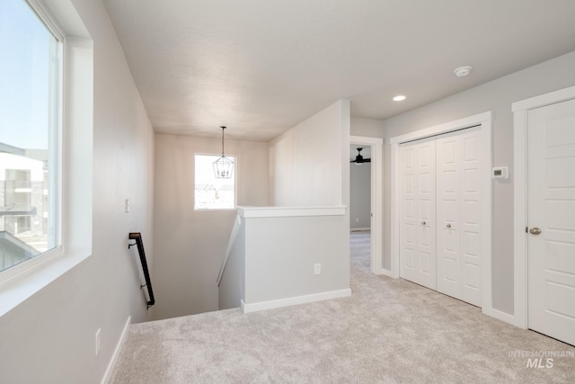 interior space featuring light colored carpet