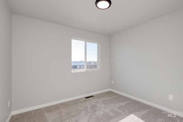 empty room with carpet flooring