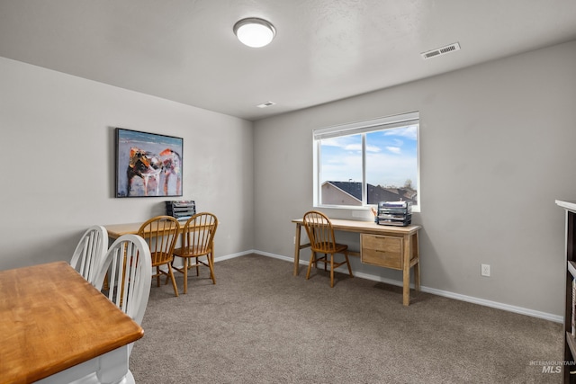 carpeted home office with visible vents and baseboards