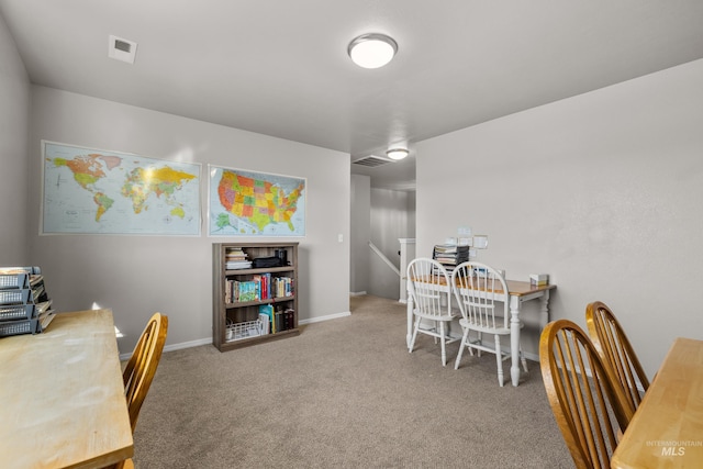 dining room featuring carpet flooring, visible vents, and baseboards