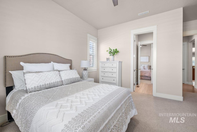 bedroom with baseboards, visible vents, and carpet flooring
