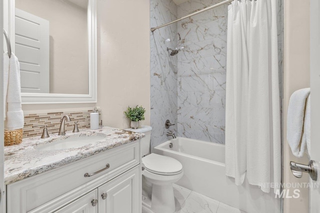full bath with shower / bath combo, toilet, backsplash, marble finish floor, and vanity