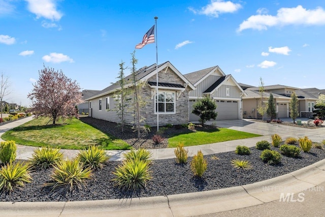 view of front facade featuring a front lawn, concrete driveway, board and batten siding, stone siding, and a garage