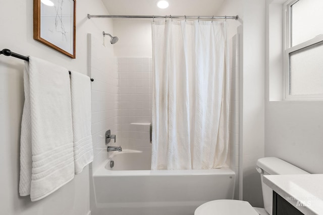 full bathroom featuring shower / tub combo with curtain, vanity, and toilet