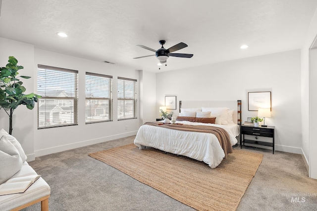 bedroom featuring ceiling fan and light colored carpet