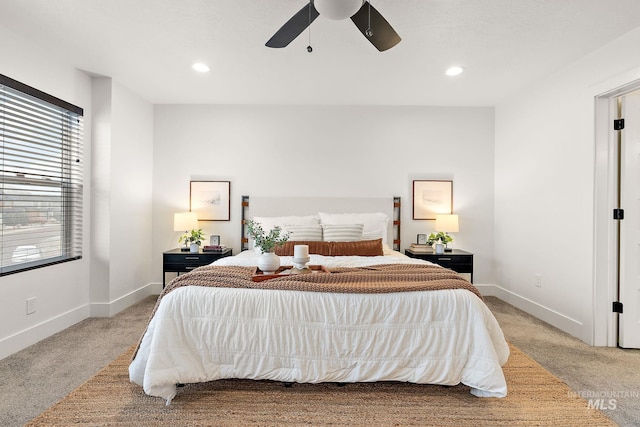 bedroom with light carpet and ceiling fan