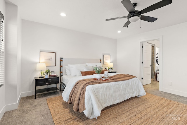 carpeted bedroom with ceiling fan