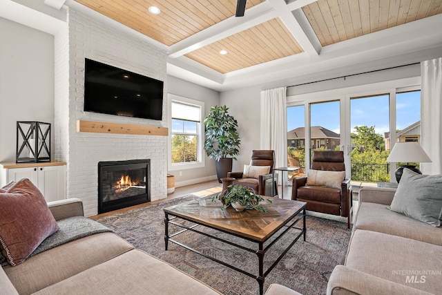 6635 Big Wood Way, Star, ID 83669 - living room featuring wooden ceiling with exposed beams, a fireplace, recessed lighting, baseboards, and wood finished floors