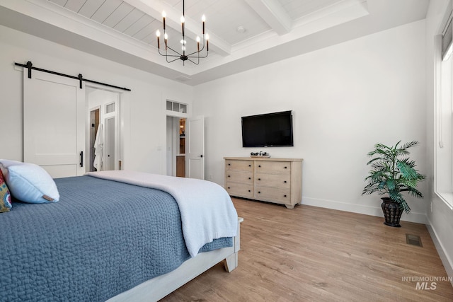 6635 Big Wood Way, Star, ID 83669 - bedroom featuring a chandelier, light wood-type flooring, a barn door, wood ceiling with exposed beams, and baseboards