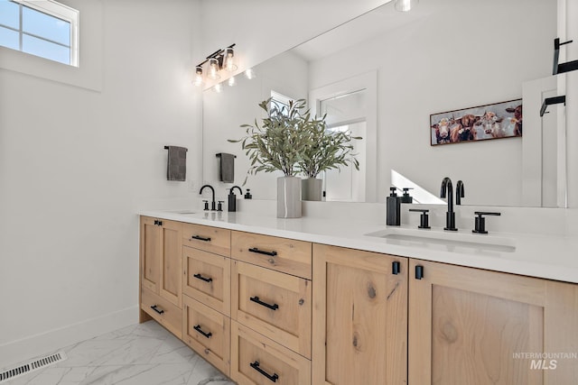 6635 Big Wood Way, Star, ID 83669 - bathroom with double vanity, baseboards, and marble finish floors