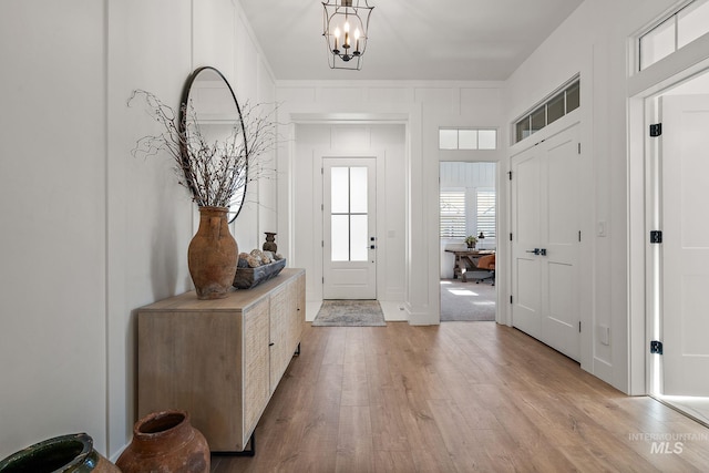 6635 Big Wood Way, Star, ID 83669 - foyer with light wood-type flooring and a chandelier
