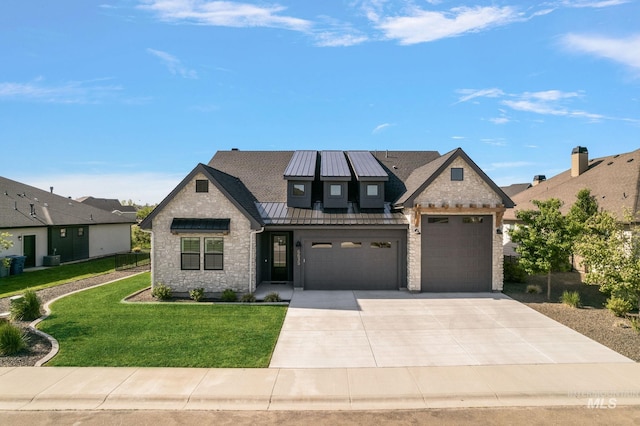 6635 Big Wood Way, Star, ID 83669 - view of front facade featuring stone siding, a standing seam roof, a front lawn, and driveway