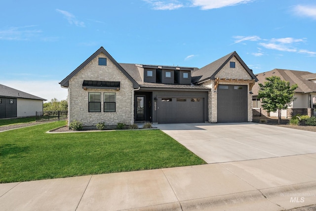 6635 Big Wood Way, Star, ID 83669 - view of front of property featuring stone siding, driveway, a garage, a standing seam roof, and metal roof