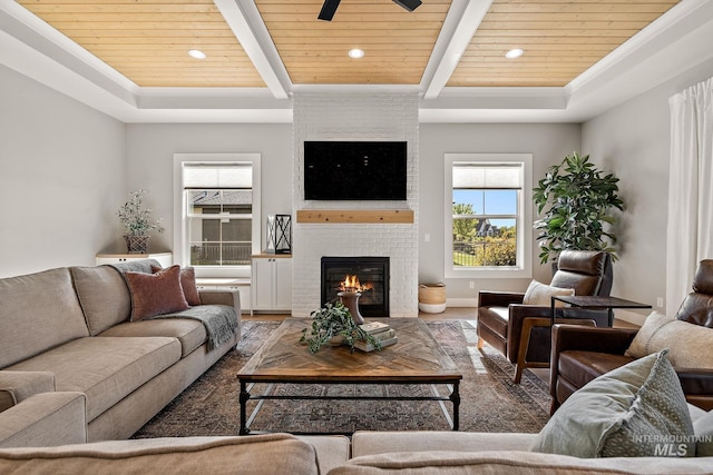 6635 Big Wood Way, Star, ID 83669 - living room with wood ceiling with exposed beams, recessed lighting, a fireplace, and wood finished floors