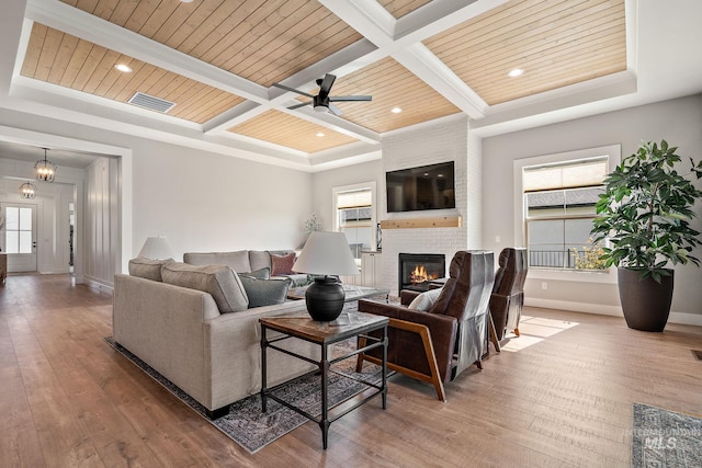 6635 Big Wood Way, Star, ID 83669 - living room featuring coffered ceiling, a fireplace, hardwood / wood-style flooring, baseboards, and recessed lighting