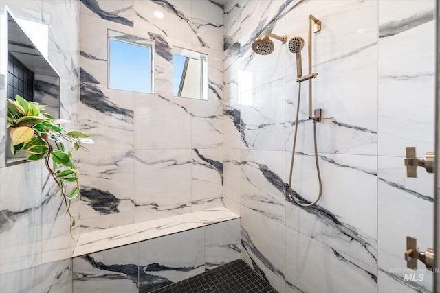 full bath with a marble finish shower