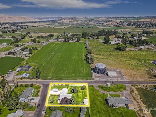 birds eye view of property with a rural view