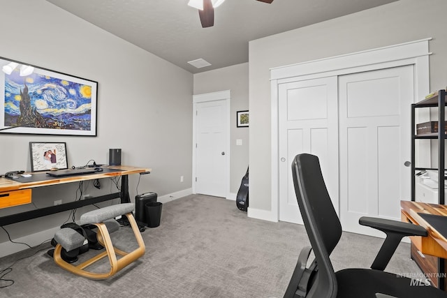 office with carpet floors, baseboards, and ceiling fan