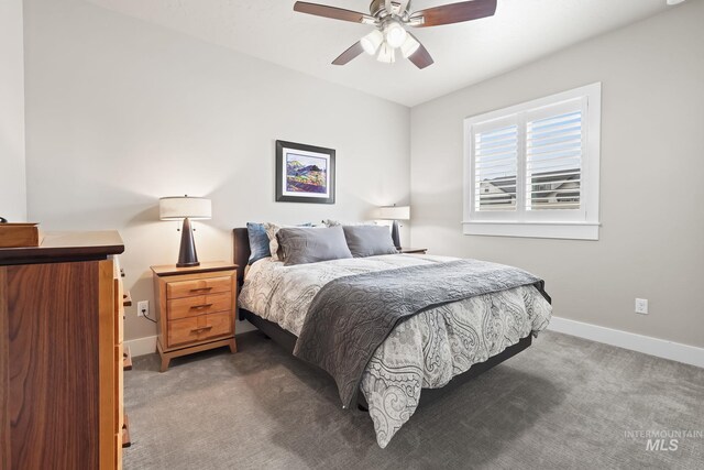 bedroom featuring baseboards, carpet flooring, and a ceiling fan