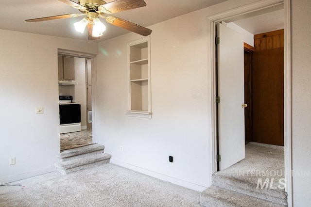 402 S Hayes, Emmett, ID 83617 - unfurnished living room with carpet, stairs, and ceiling fan