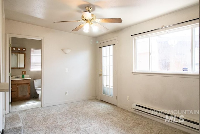 402 S Hayes, Emmett, ID 83617 - carpeted empty room with baseboard heating and a ceiling fan