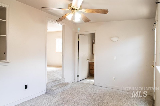 402 S Hayes, Emmett, ID 83617 - unfurnished bedroom with light carpet, a ceiling fan, and ensuite bathroom