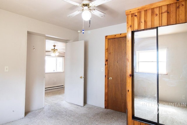402 S Hayes, Emmett, ID 83617 - spare room with ceiling fan, baseboard heating, and light carpet