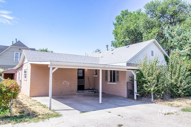 402 S Hayes, Emmett, ID 83617 - ranch-style house with concrete block siding, roof with shingles, and a carport