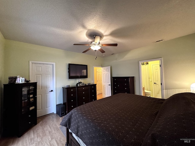 3485 N Chatterton Ave, Boise, ID 83713 - bedroom with light wood-style flooring, a textured ceiling, and ceiling fan