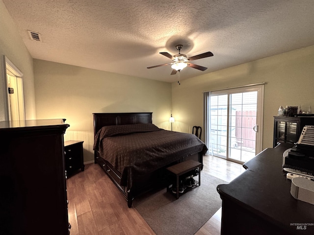 3485 N Chatterton Ave, Boise, ID 83713 - bedroom featuring access to outside, wood finished floors, a textured ceiling, and ceiling fan