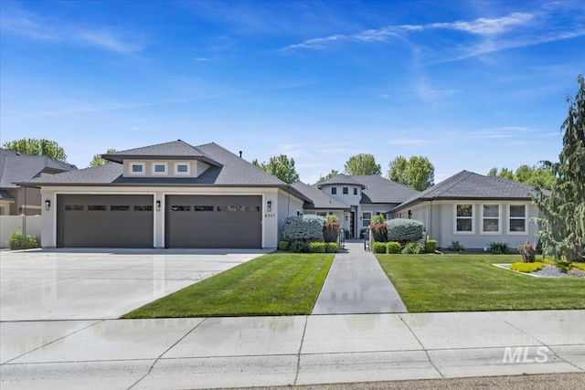 4307 W Briar Rock Ct, Eagle, ID 83616 - view of front facade featuring a garage, driveway, a front lawn, and stucco siding