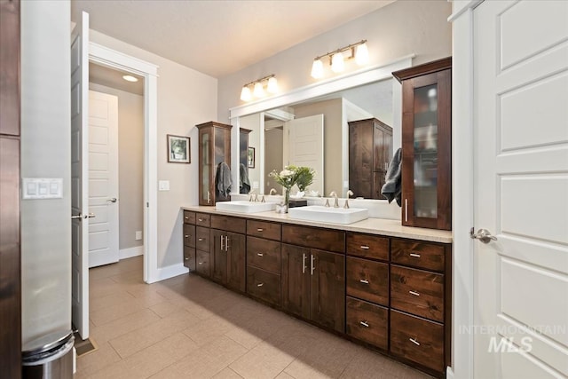4307 W Briar Rock Ct, Eagle, ID 83616 - bathroom featuring double vanity, baseboards, and tile patterned floors
