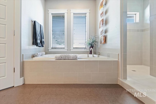 4307 W Briar Rock Ct, Eagle, ID 83616 - bathroom featuring healthy amount of natural light, a garden tub, and a tile shower