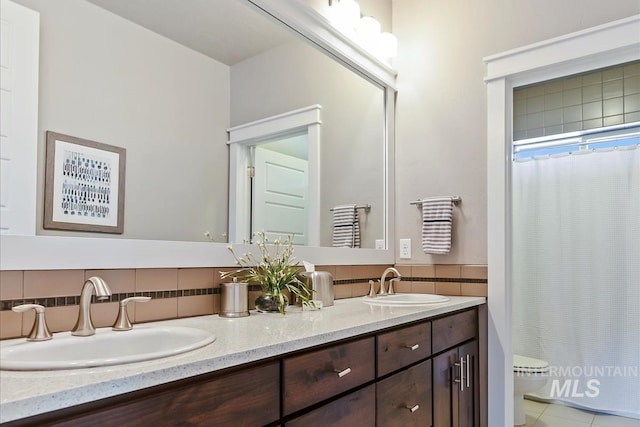 4307 W Briar Rock Ct, Eagle, ID 83616 - bathroom featuring double vanity, toilet, decorative backsplash, and a shower with shower curtain