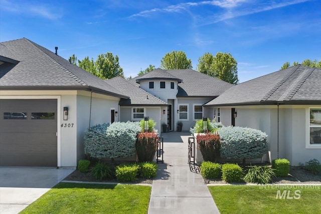 4307 W Briar Rock Ct, Eagle, ID 83616 - view of front of property with an attached garage, stucco siding, concrete driveway, and roof with shingles
