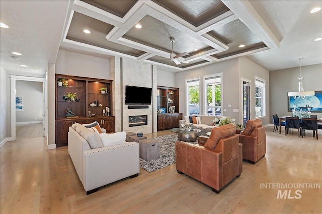 4307 W Briar Rock Ct, Eagle, ID 83616 - living area with light wood-type flooring, coffered ceiling, a fireplace, baseboards, and recessed lighting