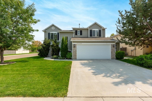 view of front facade with a garage and a front yard