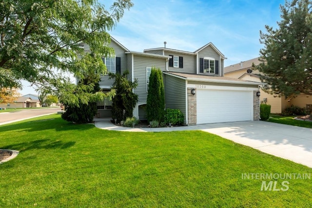 view of front of house with a garage and a front lawn