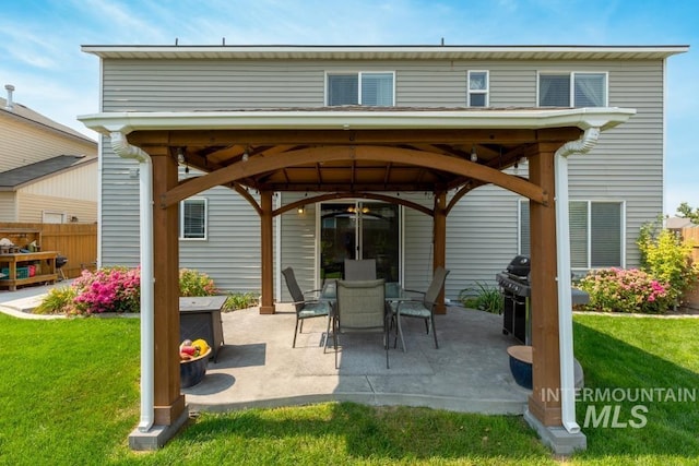 view of patio / terrace with a gazebo and fence