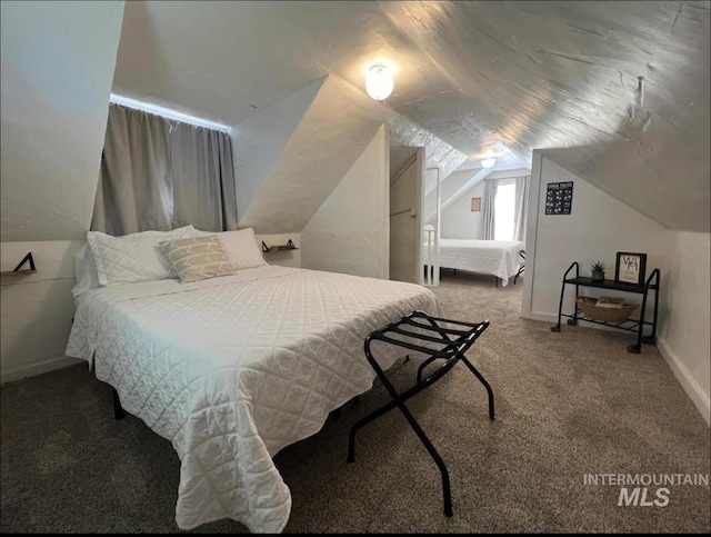 carpeted bedroom featuring vaulted ceiling