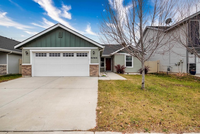 view of front of property with a front lawn and a garage