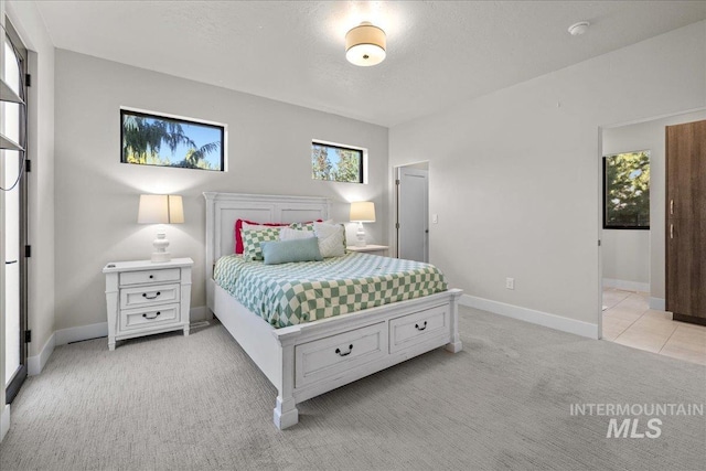 carpeted bedroom with a textured ceiling