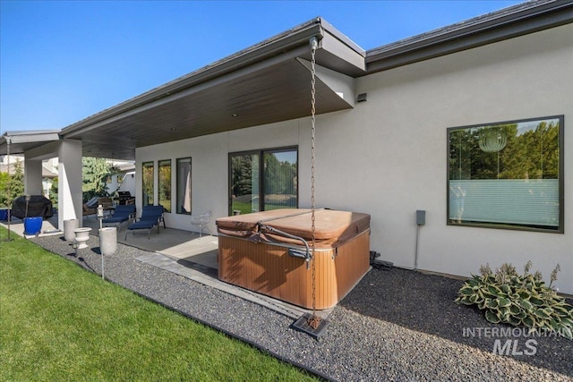 view of patio featuring a hot tub