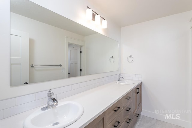 bathroom featuring tasteful backsplash and vanity