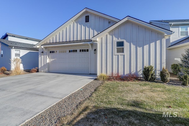 view of front of property with a garage and a front lawn