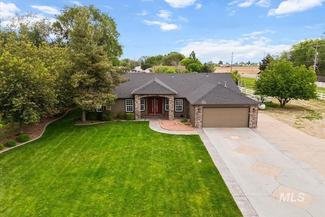 25022 Tumbleweed, Middleton, ID 83644 - view of front facade featuring driveway, an attached garage, a front yard, stone siding, and a shingled roof