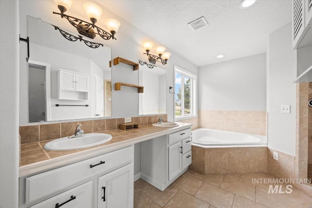 25022 Tumbleweed, Middleton, ID 83644 - full bathroom with double vanity, a bath, tile patterned flooring, a textured ceiling, and tiled shower