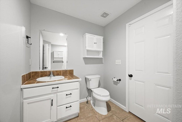 25022 Tumbleweed, Middleton, ID 83644 - bathroom featuring vanity, toilet, tile patterned flooring, and baseboards